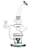Left Side: Clear glass water recycler dab rig with a showerhead perc and color accents, available for sale at High Roller Smoke in Lakewood, Colorado. 