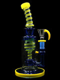 9 inch glass water pipe incycler rig with yellow and blue ribbon tubing on neck and inside chamber 