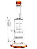 Left Side: Clear glass water pipe featuring double chamber straight tube with tree percs and honeycomb perc, and amber color accents, available for sale at High Roller Smoke in Lakewood, Colorado. 