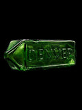 Green heady glass hand pipe by American artist Kuhns Glass with engraved lettering DENVER on one side