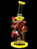11 inch glass water pipe rig by Lookah Tataoo Glass, featuring a red fish and pink implosion flower marble with yellow and amber color accents, for sale at High Roller Smoke in Lakewood, Colorado.