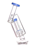 Monark Glass Clear glass water pipe Puffco Peak attachment with blue accents, a side-arm mouthpiece, and a matrix perc on a white background