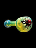 A fully fumed smoking glass hand pipe spoon shaped with ladybug on front