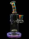 8.5 inch glass can water pipe rig with rainbow wig-wag neck, colorful swirl tire perc, honey-drip accents on body, and milky purple base